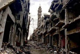 La evacuación del barrio Al Waer de la ciudad siria de HomsPrimer grupo de combatientes y civiles abandona Homs